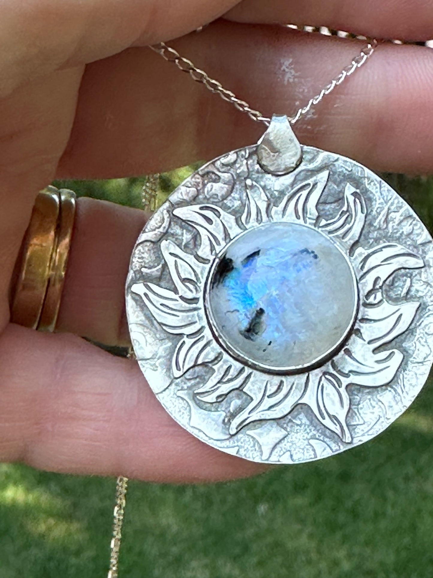 Moonstone set in a "Fiery" Sunburst Sterling Silver setting