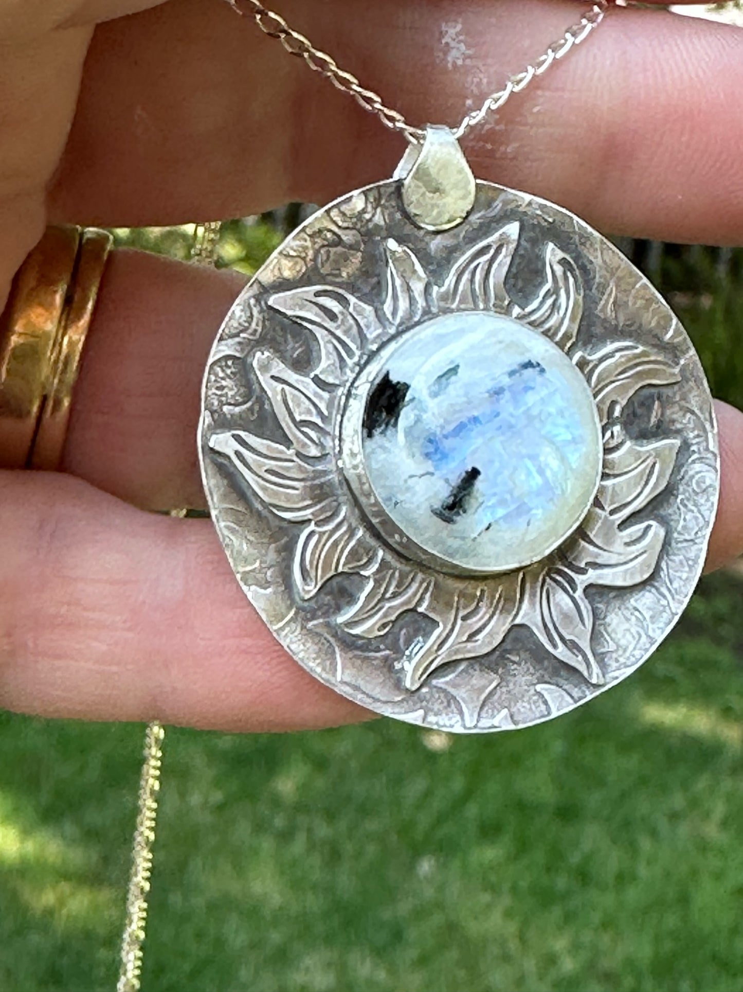 Moonstone set in a "Fiery" Sunburst Sterling Silver setting