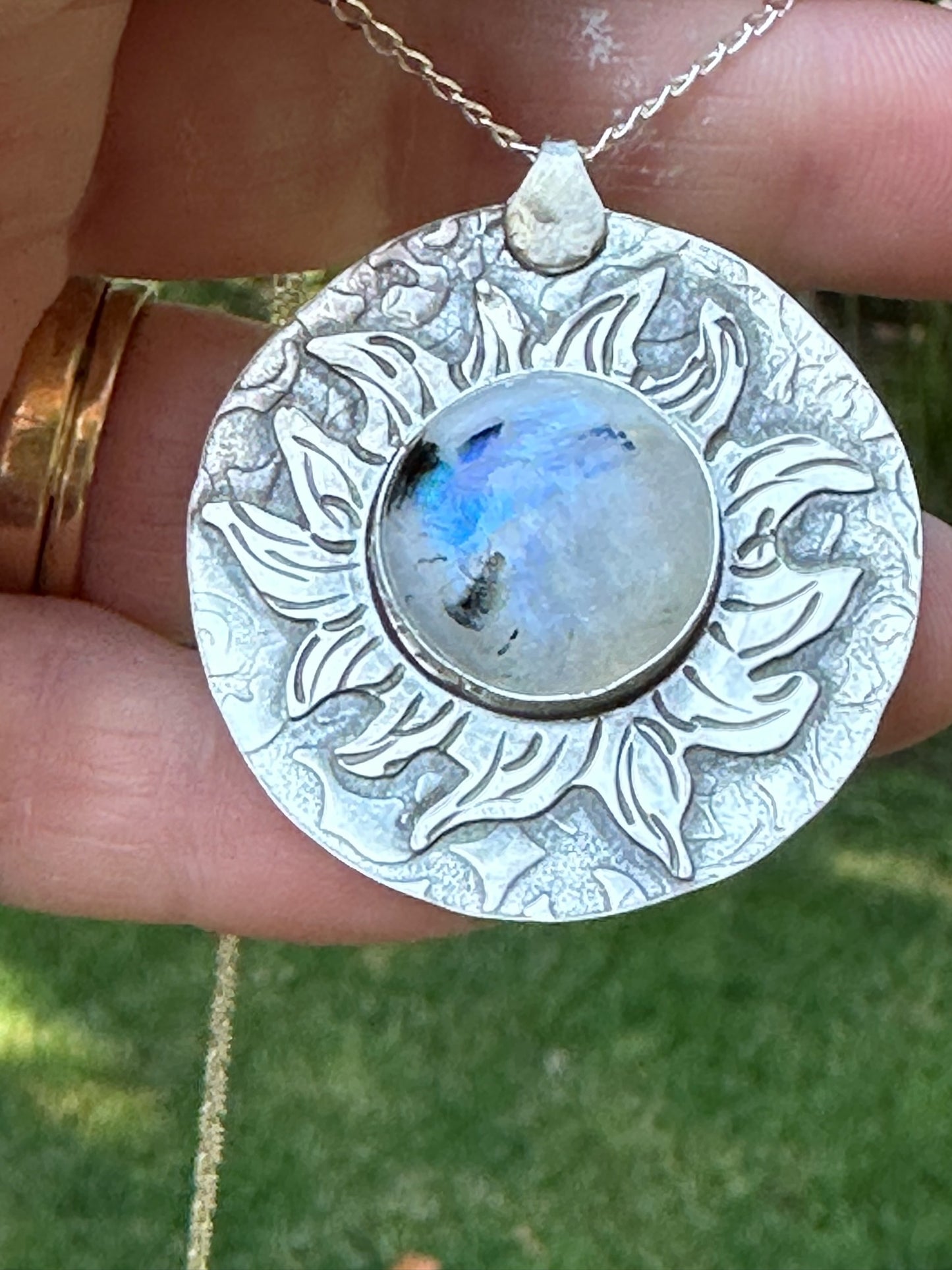 Moonstone set in a "Fiery" Sunburst Sterling Silver setting